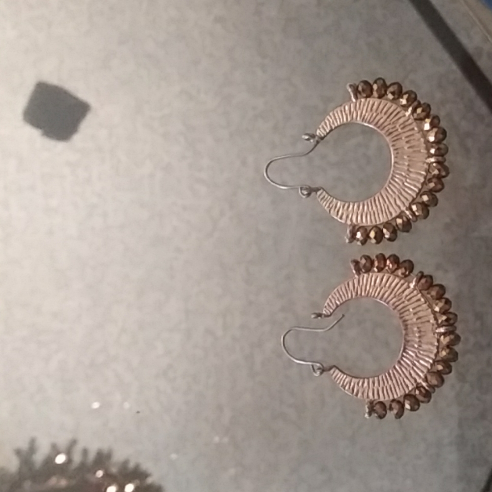 Gold hoop earrings with gold beads